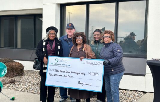 African American Museum with Big Check